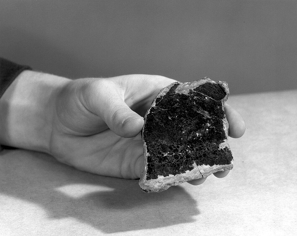 Black Uraninite (Pitchblende) specimen, a highly radioactive uranium ore.
